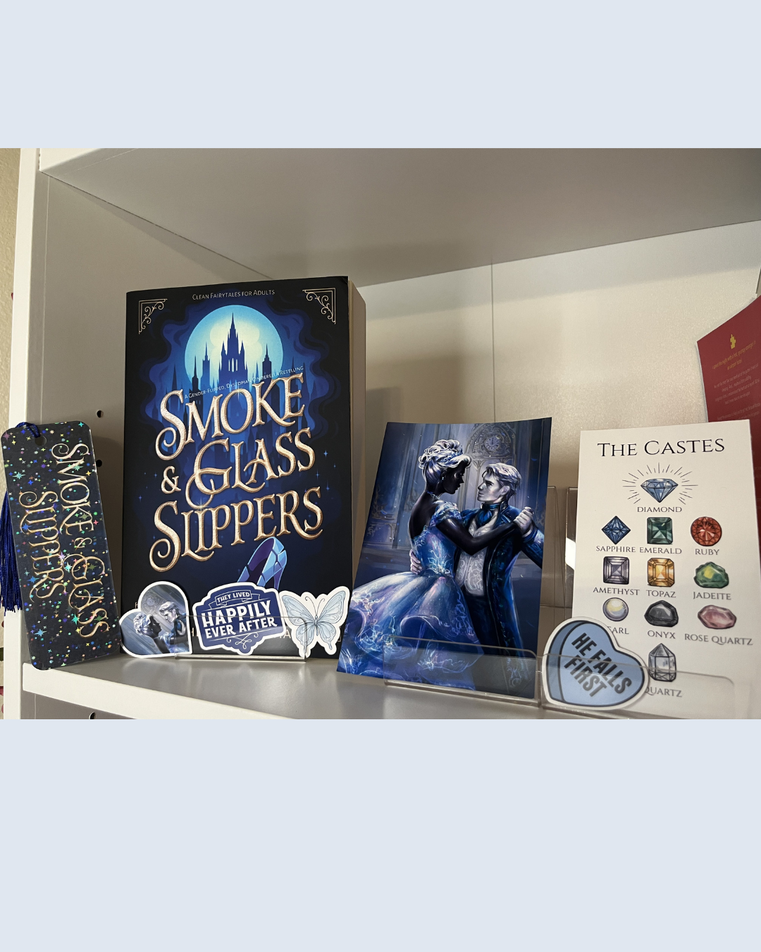 Book   titled 'Smoke & Glass Slippers' on a shelf with other related items.